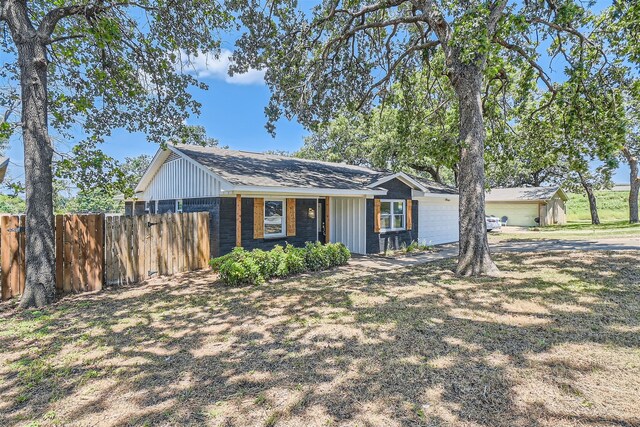 single story home featuring a garage