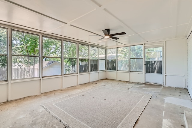 unfurnished sunroom with ceiling fan