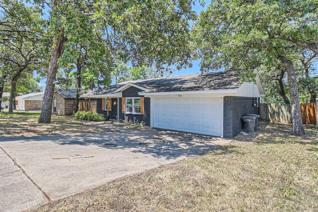 ranch-style home featuring a garage