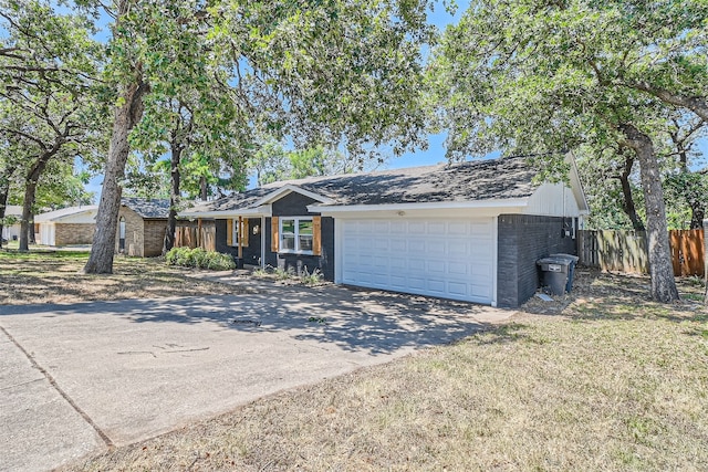 ranch-style home featuring a garage