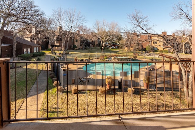 view of swimming pool featuring a jacuzzi