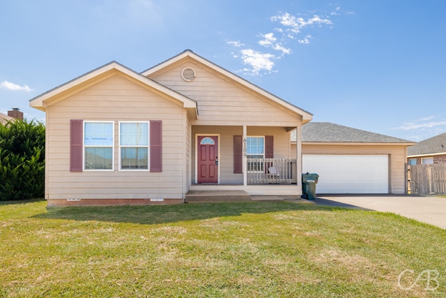 view of front of property featuring a front yard, a porch, and a garage