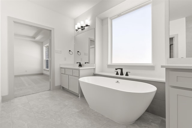 bathroom with a tub to relax in, vanity, and tile walls