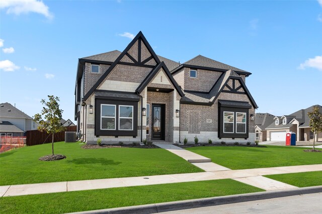 5249 Deep Creek Dr, Fort Worth, TX 76179 - view of front of house with brick siding, cooling unit, and a shingled roof