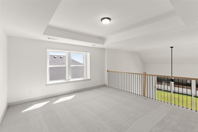 bonus room with light colored carpet