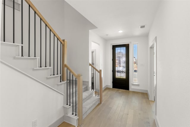 entrance foyer with light hardwood / wood-style flooring