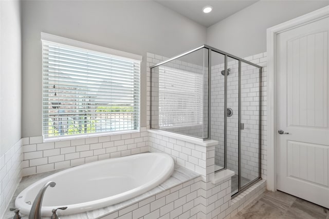 bathroom featuring tile patterned floors and shower with separate bathtub