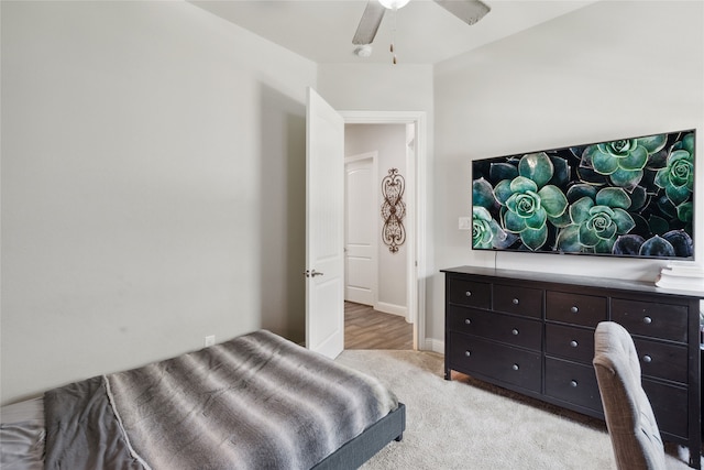 carpeted bedroom with ceiling fan