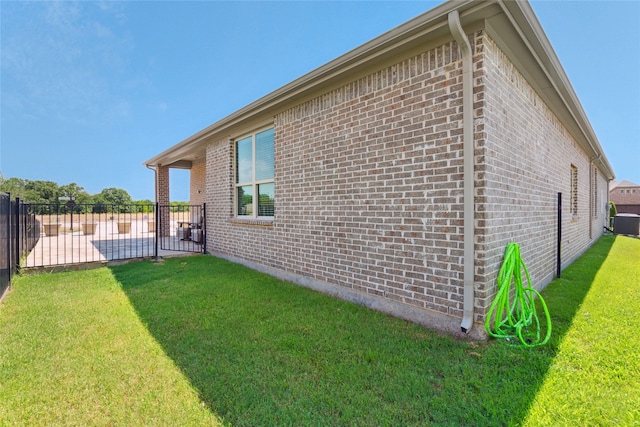 view of property exterior with a lawn