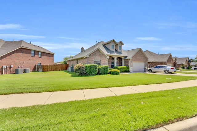 view of front of property featuring central air condition unit and a front lawn