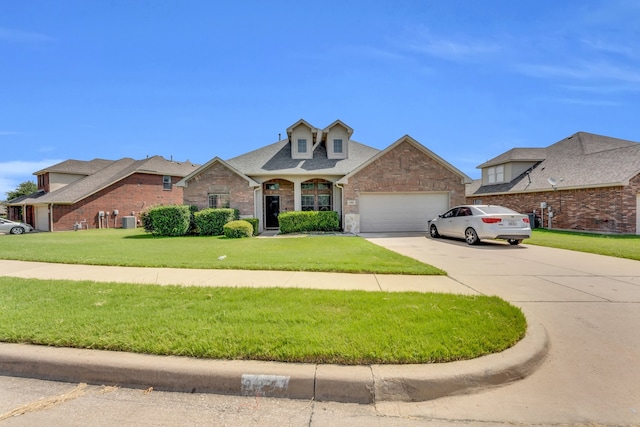 view of front facade featuring a front lawn and a garage