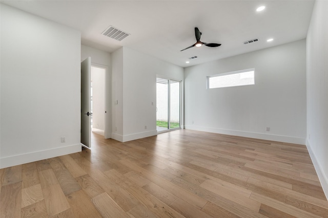 unfurnished room with ceiling fan and light wood-type flooring