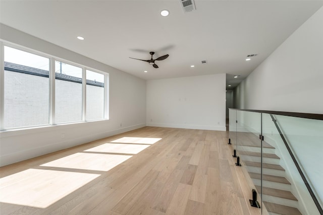 unfurnished room featuring ceiling fan and light hardwood / wood-style floors