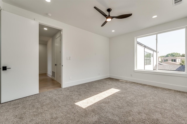 spare room with ceiling fan and carpet floors