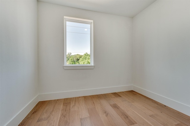 spare room featuring light wood-type flooring