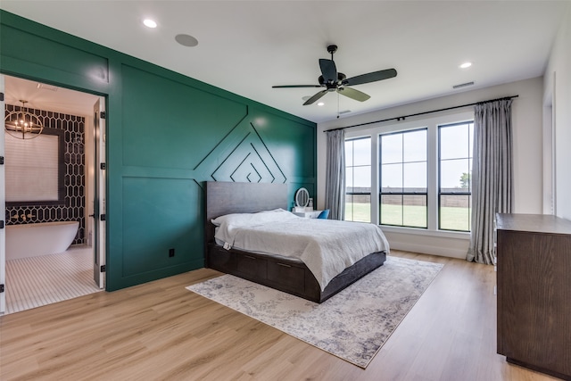 bedroom featuring ceiling fan and light hardwood / wood-style flooring