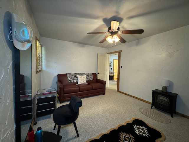 living room featuring ceiling fan and carpet floors