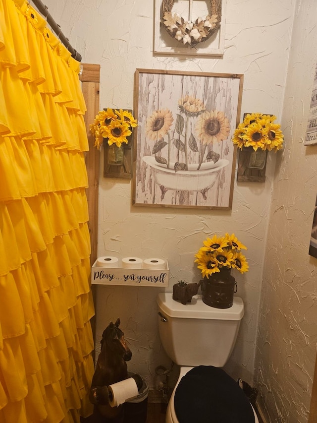 bathroom featuring toilet