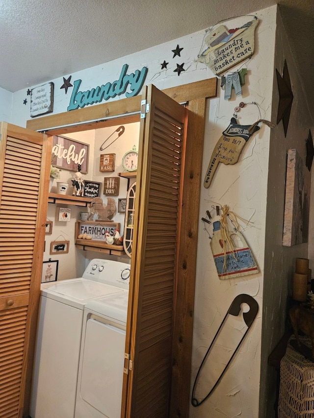 laundry area featuring independent washer and dryer and a textured ceiling