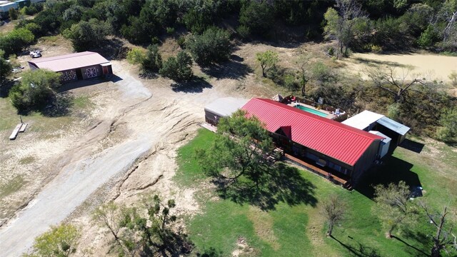 birds eye view of property with a rural view