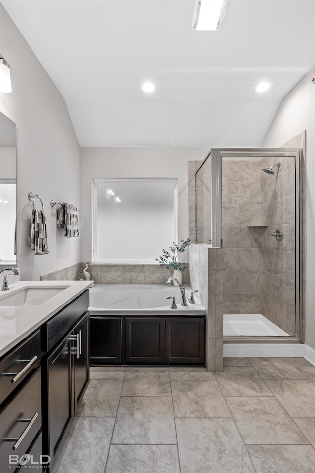 bathroom featuring lofted ceiling, tile patterned floors, and plus walk in shower