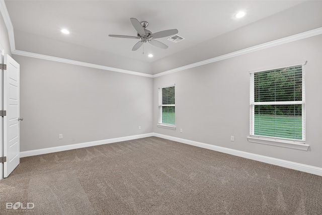 unfurnished room featuring ornamental molding, ceiling fan, and dark carpet