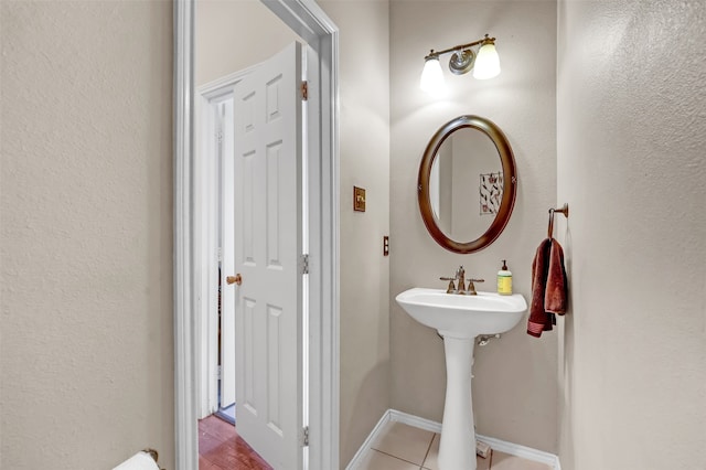 bathroom with tile patterned flooring