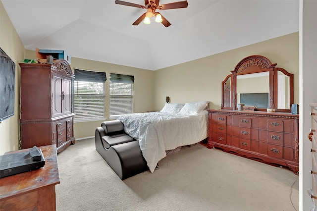 bedroom featuring ceiling fan, lofted ceiling, and light carpet