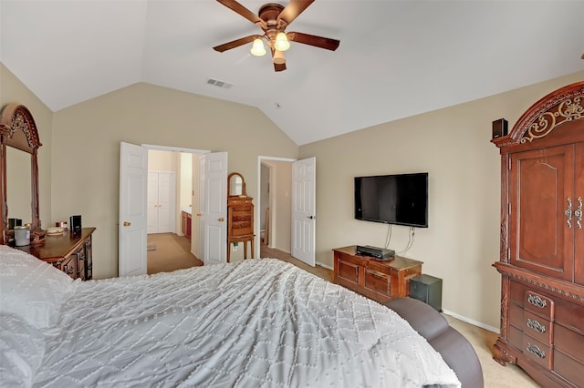 bedroom with ceiling fan, light carpet, and vaulted ceiling