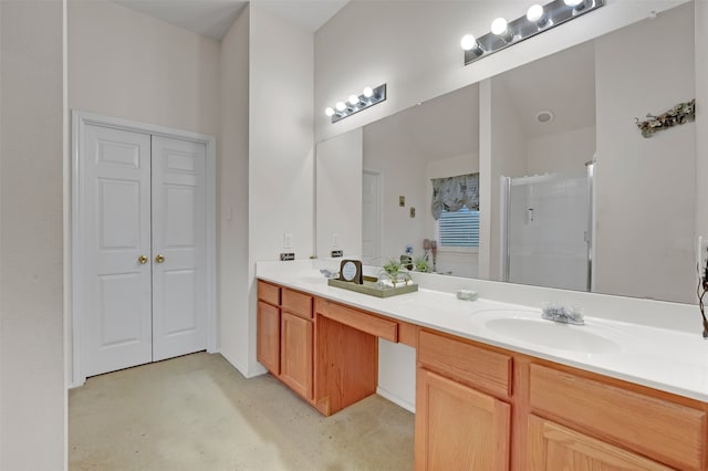 bathroom featuring vanity and an enclosed shower