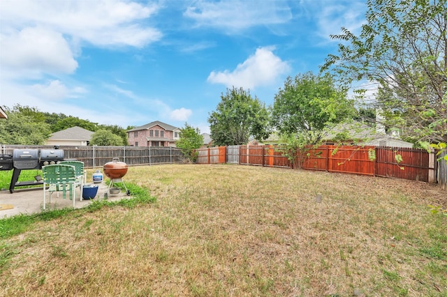 view of yard featuring a fenced backyard and a patio