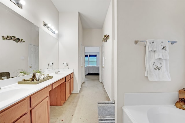 bathroom with a tub to relax in and vanity