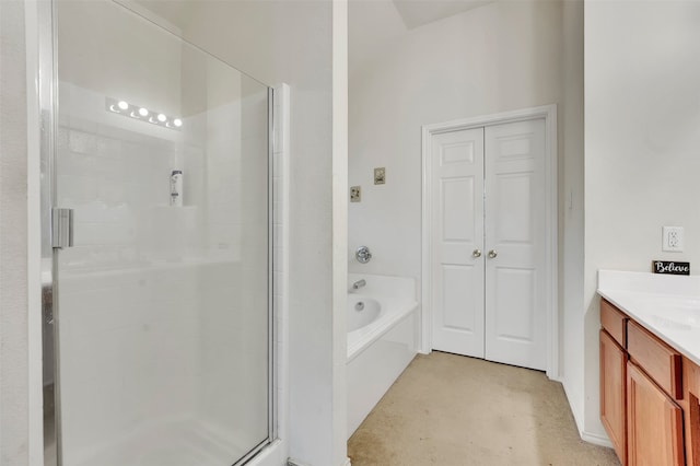 bathroom with vanity and shower with separate bathtub