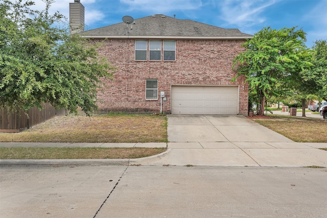 view of front of house featuring concrete driveway, a chimney, an attached garage, fence, and brick siding
