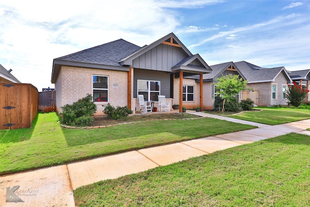 craftsman-style house with a front lawn