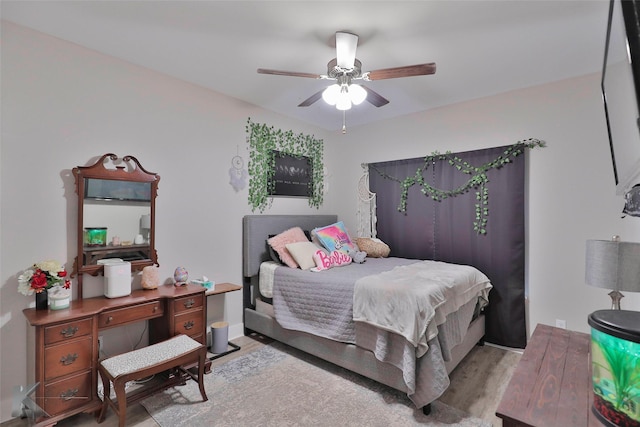 bedroom featuring ceiling fan and light hardwood / wood-style floors