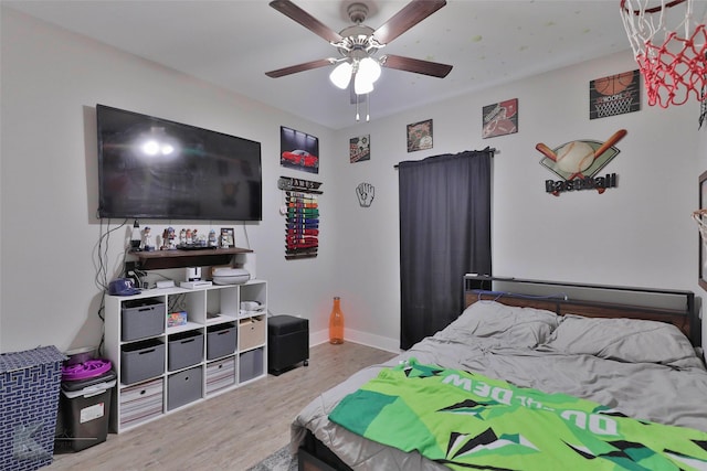 bedroom featuring hardwood / wood-style flooring and ceiling fan