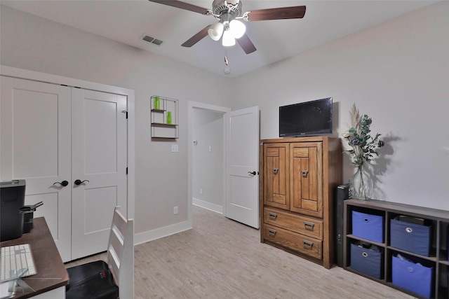 home office featuring ceiling fan and light wood-type flooring