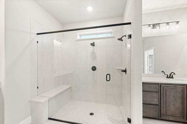 bathroom featuring vanity and an enclosed shower