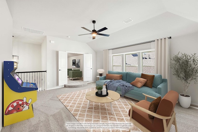 carpeted living room with ceiling fan and vaulted ceiling