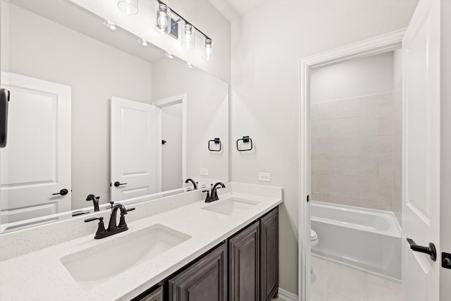 full bathroom with washtub / shower combination, vanity, and toilet