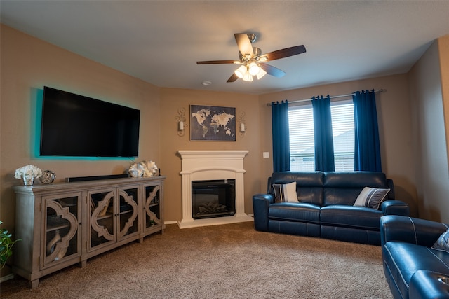 carpeted living room with ceiling fan