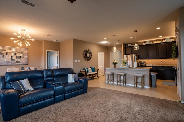 tiled living room featuring a chandelier