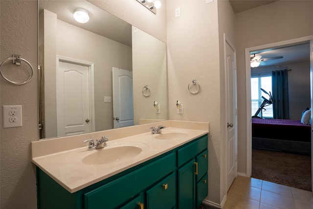 bathroom with dual vanity, tile patterned floors, and ceiling fan