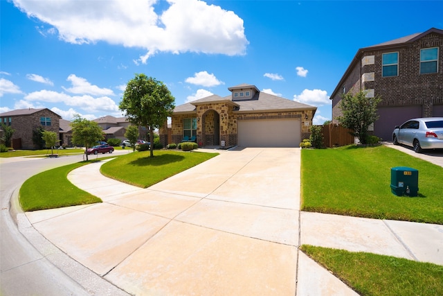 view of front facade featuring a garage and a front yard