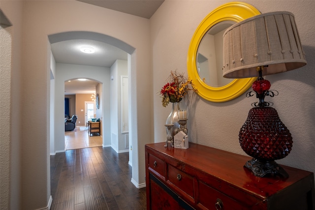 hallway featuring dark hardwood / wood-style flooring