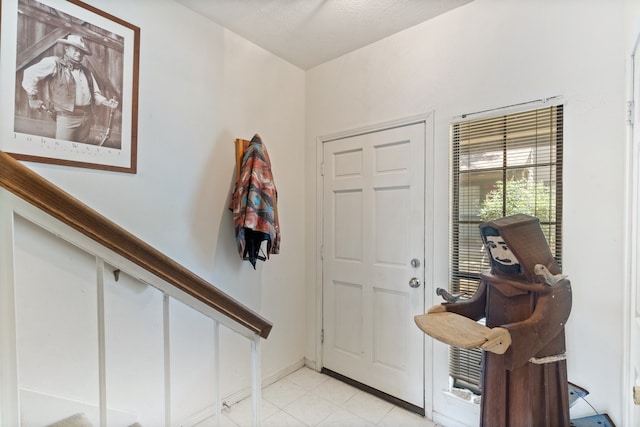 view of tiled foyer entrance