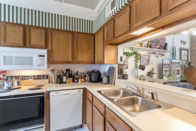 kitchen with sink and white appliances