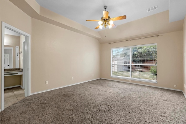 unfurnished room with light carpet, lofted ceiling, and ceiling fan