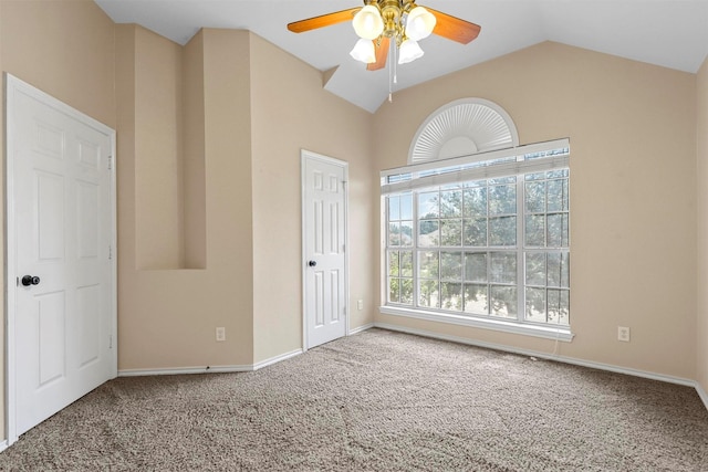 unfurnished room with lofted ceiling, carpet floors, and ceiling fan